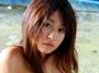 	Risa Misaki,Sexy Asian babe in a sarong shows off her ass
